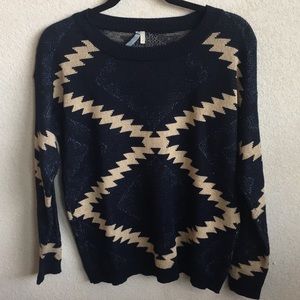 Navy blue sweater with tan pattern.
